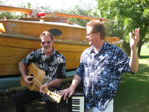 Bob plays a fancy chord on the guitar as Jim pontificates about the meaning of life