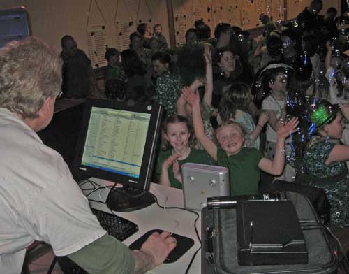 DJ Kozy readies some requests for some young revelers