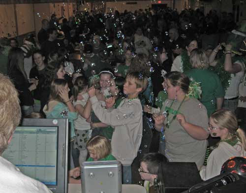 Bubbles float while DJ Kozy spins for a packed house